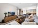 Cozy living room with modern decor, hardwood floors, and a view to a well-appointed kitchen at 6320 E Gloria Ln, Cave Creek, AZ 85331
