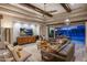 Large living room area with hardwood floors, sectional couch, and desert views at 6320 E Gloria Ln, Cave Creek, AZ 85331
