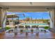 Outdoor dining area with view of pool, bar, and desert landscape at 6320 E Gloria Ln, Cave Creek, AZ 85331