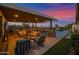 A spacious covered patio with a full kitchen and comfortable seating areas at 6320 E Gloria Ln, Cave Creek, AZ 85331