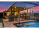 Outdoor pool features a covered lounge area with a bar, seating, and water feature at sunset at 6320 E Gloria Ln, Cave Creek, AZ 85331