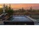 This modern pool area has desert views with a relaxing lounge area and desert landscaping at 6320 E Gloria Ln, Cave Creek, AZ 85331