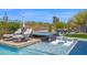 Luxurious pool with a hot tub, tanning ledges, and lounge chairs, surrounded by lush landscaping at 6320 E Gloria Ln, Cave Creek, AZ 85331