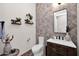 Stylish powder room with unique tile and a modern sink at 6320 E Gloria Ln, Cave Creek, AZ 85331