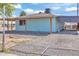 View of the home's backyard featuring a rocked area with some fence materials at 6447 W Piccadilly Rd, Phoenix, AZ 85033