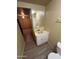 Bathroom featuring a dated vanity with a large mirror, basic sink and toilet at 6447 W Piccadilly Rd, Phoenix, AZ 85033