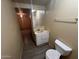 Bathroom featuring a dated vanity with a large mirror, basic sink and toilet at 6447 W Piccadilly Rd, Phoenix, AZ 85033