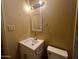 This bathroom features a new vanity, mirror, updated lighting and fixtures, plus a modern sink and toilet at 6447 W Piccadilly Rd, Phoenix, AZ 85033