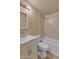 Well-lit bathroom featuring a bathtub, updated marble-look shower surround, and vanity at 6447 W Piccadilly Rd, Phoenix, AZ 85033