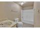 Bright bathroom features a shower-tub combination and wood look vinyl flooring at 6447 W Piccadilly Rd, Phoenix, AZ 85033