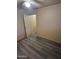 This bedroom provides a closet and door leading to other rooms, plus modern vinyl flooring at 6447 W Piccadilly Rd, Phoenix, AZ 85033