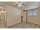 Bedroom featuring neutral paint, ceiling fan, wood-look flooring, and a closet at 6447 W Piccadilly Rd, Phoenix, AZ 85033