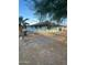 Cozy light-blue home featuring a sturdy porch and shaded by a large tree at 6447 W Piccadilly Rd, Phoenix, AZ 85033