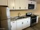 Well-lit kitchen with stainless steel appliances, modern cabinets, and granite countertops at 6447 W Piccadilly Rd, Phoenix, AZ 85033