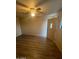 Living room with light, ceiling fan and wood-look floors at 6447 W Piccadilly Rd, Phoenix, AZ 85033