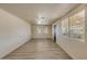 Bright living room features hard surface floors and lots of windows at 6447 W Piccadilly Rd, Phoenix, AZ 85033