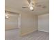 Living room with neutral walls, new wood-look flooring, a ceiling fan, and an exterior door at 6447 W Piccadilly Rd, Phoenix, AZ 85033