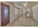 Living room with an open layout, hard surface floors and a ceiling fan at 6447 W Piccadilly Rd, Phoenix, AZ 85033