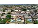Aerial shot of houses with pools, landscaping, and solar panels in a residential neighborhood at 6457 E Encanto St, Mesa, AZ 85205