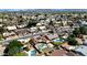 A high angle aerial view showing neighborhood street layout, houses, swimming pools and solar panels at 6457 E Encanto St, Mesa, AZ 85205