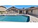 Backyard featuring pool, landscaping, solar panels and a patio at 6457 E Encanto St, Mesa, AZ 85205