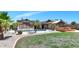 Beautiful backyard featuring a pool, covered patio, and lush landscaping for outdoor enjoyment at 6457 E Encanto St, Mesa, AZ 85205