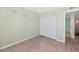 Bedroom with wood floor, closet and light green walls with quote art at 6457 E Encanto St, Mesa, AZ 85205