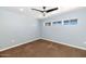 Clean blue bedroom featuring carpet, recessed lighting, and neutral window trim at 6457 E Encanto St, Mesa, AZ 85205