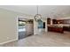 Dining area with hardwood floors, modern lighting, and sliding door to patio at 6457 E Encanto St, Mesa, AZ 85205