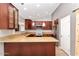 Well-equipped kitchen with stainless steel appliances, granite counters, and ample storage at 6457 E Encanto St, Mesa, AZ 85205
