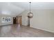 Spacious living room featuring hardwood floors and stylish light fixtures at 6457 E Encanto St, Mesa, AZ 85205
