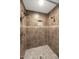 Close up of the bathroom showing the shower with a tiled surround, shower head and niche at 6457 E Encanto St, Mesa, AZ 85205