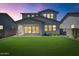 Home exterior with a large backyard featuring a covered patio, perfect for outdoor entertaining at 6743 N 9Th Dr, Phoenix, AZ 85013
