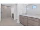 Modern bathroom featuring a glass-enclosed shower, dual vanities, and contemporary fixtures at 6743 N 9Th Dr, Phoenix, AZ 85013