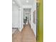Bright entryway with hardwood floors, a long runner rug, and stylish modern interior doors at 6743 N 9Th Dr, Phoenix, AZ 85013