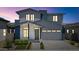 Beautiful two-story home with a brick driveway, white exterior, and inviting front entryway at 6743 N 9Th Dr, Phoenix, AZ 85013