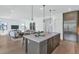 Open-concept kitchen with a large island, stainless steel appliances, and seamlessly connected living space at 6743 N 9Th Dr, Phoenix, AZ 85013