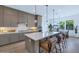 Beautiful kitchen features an island with seating, stainless steel appliances, and modern finishes at 6743 N 9Th Dr, Phoenix, AZ 85013