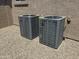 Two RunTru air conditioning units sit outside next to a light brown house with desert landscaping at 6931 E Teton Cir, Mesa, AZ 85207