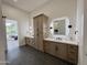 Bright bathroom featuring double vanities, custom storage, and modern light fixtures at 6931 E Teton Cir, Mesa, AZ 85207