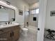 Beautiful bathroom featuring tiled floors, a wood vanity, and combination shower tub at 6931 E Teton Cir, Mesa, AZ 85207