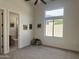 Spacious bedroom with neutral carpet, ceiling fan, and ensuite bathroom at 6931 E Teton Cir, Mesa, AZ 85207