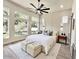 Bright, spacious bedroom featuring large windows, a modern ceiling fan, and neutral decor at 6931 E Teton Cir, Mesa, AZ 85207