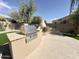 Outdoor BBQ grill and cooking area in backyard featuring desert landscaping and ample space at 6931 E Teton Cir, Mesa, AZ 85207