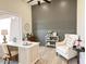Stylish home office with custom wall detail, wood floors and lots of natural light at 6931 E Teton Cir, Mesa, AZ 85207
