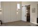 Living space featuring a sliding barn door, wood floors, and updated light fixtures at 6931 E Teton Cir, Mesa, AZ 85207