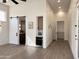 Open living space features wood floors, a sliding barn door, beverage cooler, and modern lighting at 6931 E Teton Cir, Mesa, AZ 85207