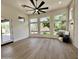 Open-concept living area features large windows, wood flooring, and ample natural light at 6931 E Teton Cir, Mesa, AZ 85207