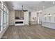 A large and bright living room with a fireplace, hardwood floors, and an open layout at 6931 E Teton Cir, Mesa, AZ 85207