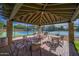 Covered patio with seating area overlooking the community pickleball courts at 6931 E Teton Cir, Mesa, AZ 85207